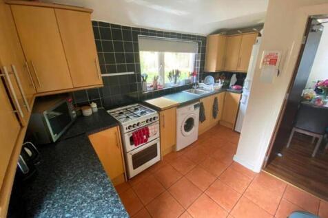 A bright and functional kitchen with ample stor...