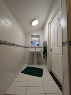 A bright and clean bathroom featuring a modern ...