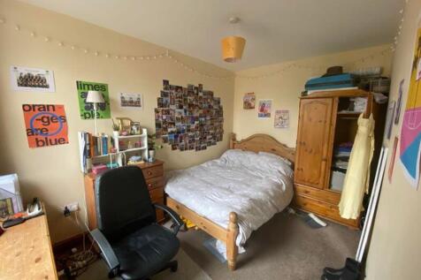 A cozy and inviting double bedroom with persona...