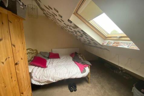 A charming double bedroom with natural light an...