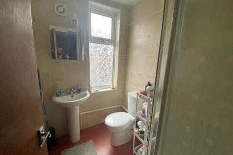 A tidy bathroom featuring a modern sink and amp...