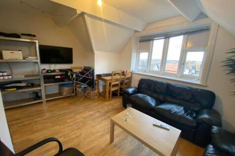 A spacious and inviting modern living room with...
