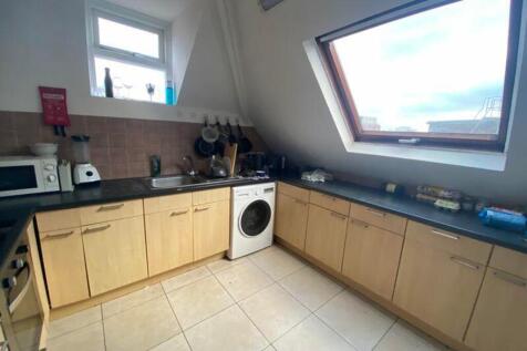 A bright and functional kitchenette with modern...