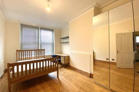 A bright and spacious double bedroom featuring ...