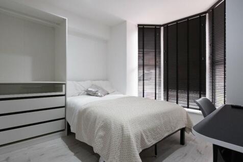 A stylish and inviting double bedroom featuring...