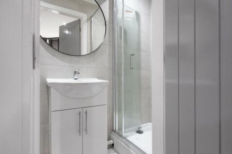 A modern and clean bathroom featuring a stylish...