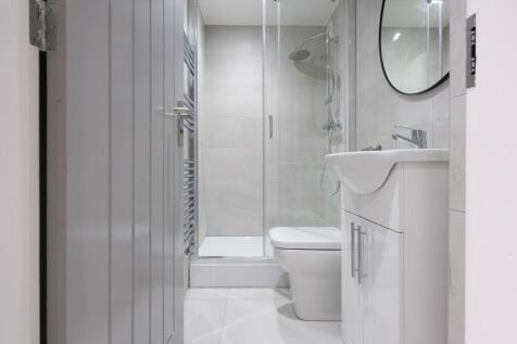 A modern and stylish bathroom featuring a sleek...