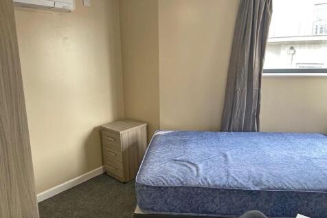 Spacious double bedroom featuring a comfortable...