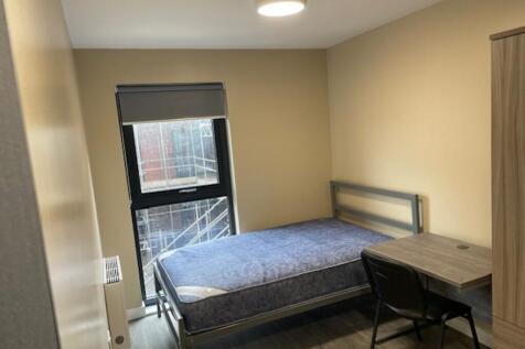 Bright and spacious double bedroom featuring a ...