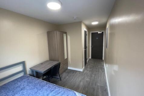 Spacious double bedroom featuring a comfortable...
