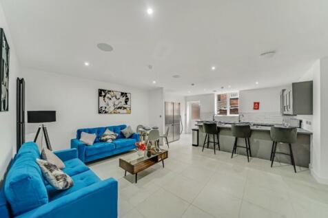 A spacious and stylish modern living room with ...