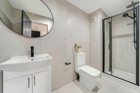 A modern and stylish bathroom featuring a sleek...