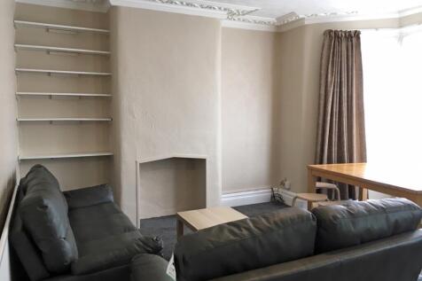 Spacious and inviting living room featuring com...