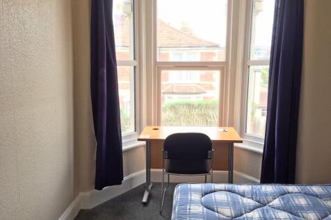 Bright and cozy double bedroom featuring large ...