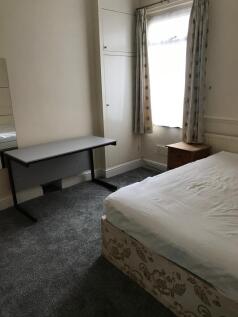 A cozy double bedroom featuring a comfortable b...