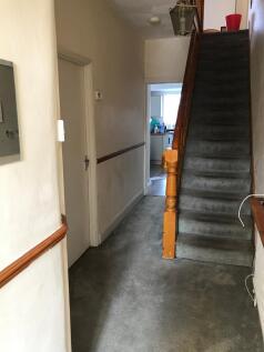 Welcoming hallway with ample space, leading to ...