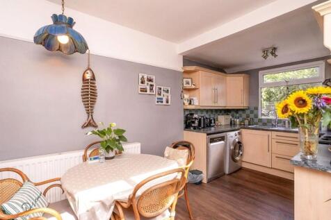 Bright and inviting kitchen featuring modern ap...