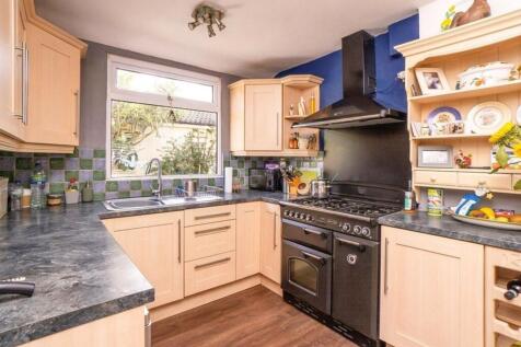 This charming kitchen features a functional lay...