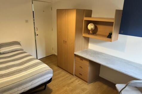 Spacious double bedroom featuring a comfortable...