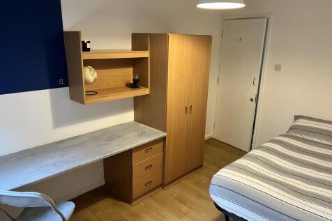 Cozy double bedroom featuring a well-organized ...