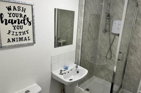 Modern bathroom featuring a sleek shower, styli...