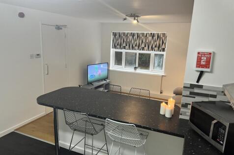 Modern kitchen with a stylish breakfast bar, eq...