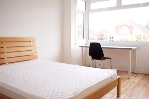 Bright and spacious double bedroom featuring la...