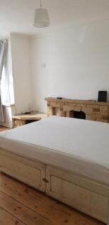 Spacious double bedroom featuring ample natural...