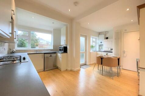 A bright and spacious kitchen featuring modern ...