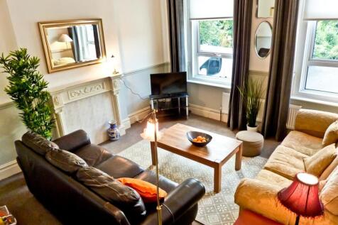 A spacious and inviting large modern living roo...