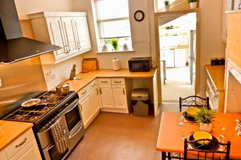 A bright and clean kitchen with modern applianc...