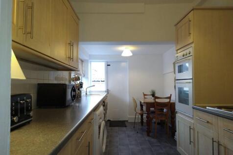 A well-appointed kitchen featuring modern cabin...