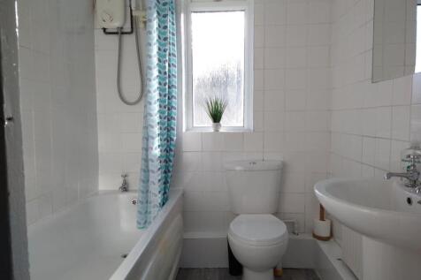A bright and well-maintained bathroom featuring...