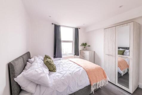 A beautifully designed double bedroom featuring...