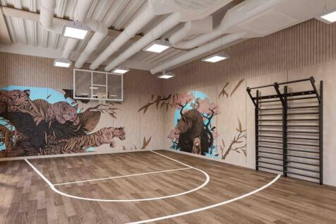 A spacious and well-lit gym area, perfect for s...