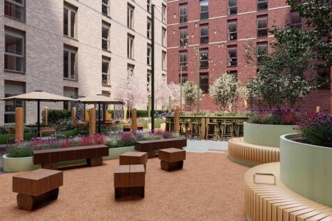 A beautifully designed garden area with ample s...