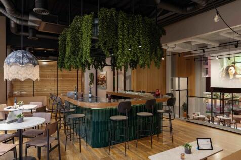 A vibrant communal lounge featuring a stylish b...