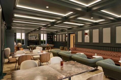A stylish and spacious communal lounge area per...