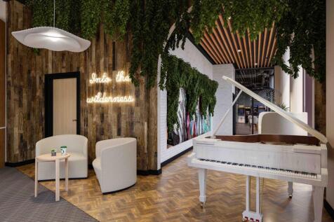 A stylish and inviting communal lounge featurin...