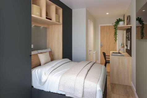 A stylish and well-lit double bedroom featuring...