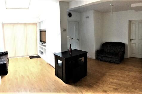 Spacious living area with ample natural light, ...