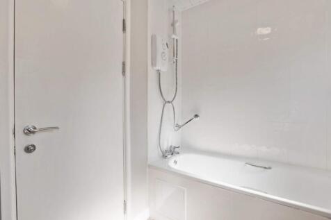 A bright and well-maintained bathroom featuring...