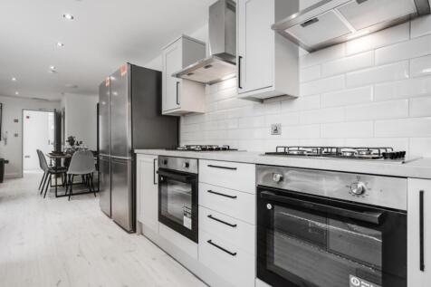 A modern and clean kitchenette featuring sleek ...