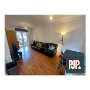 Spacious and inviting living room featuring amp...