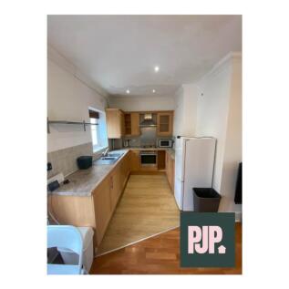 A well-appointed kitchen featuring modern appli...