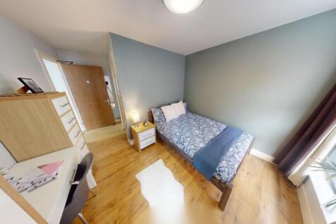 A bright and inviting double bedroom featuring ...