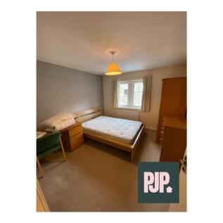 This inviting double bedroom features ample spa...