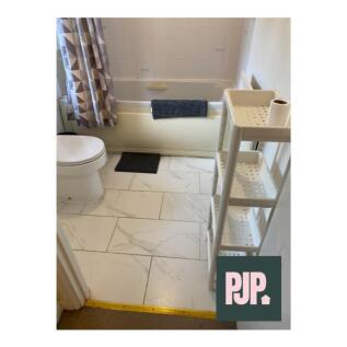 A well-maintained bathroom featuring a relaxing...