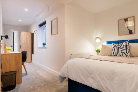 A beautifully designed double bedroom featuring...