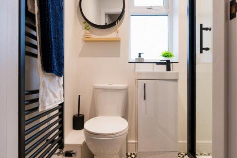 A modern and stylish bathroom featuring a sleek...